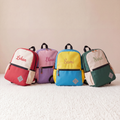 Personalized colour-block kids backpacks with embroidered names in four retro colourways