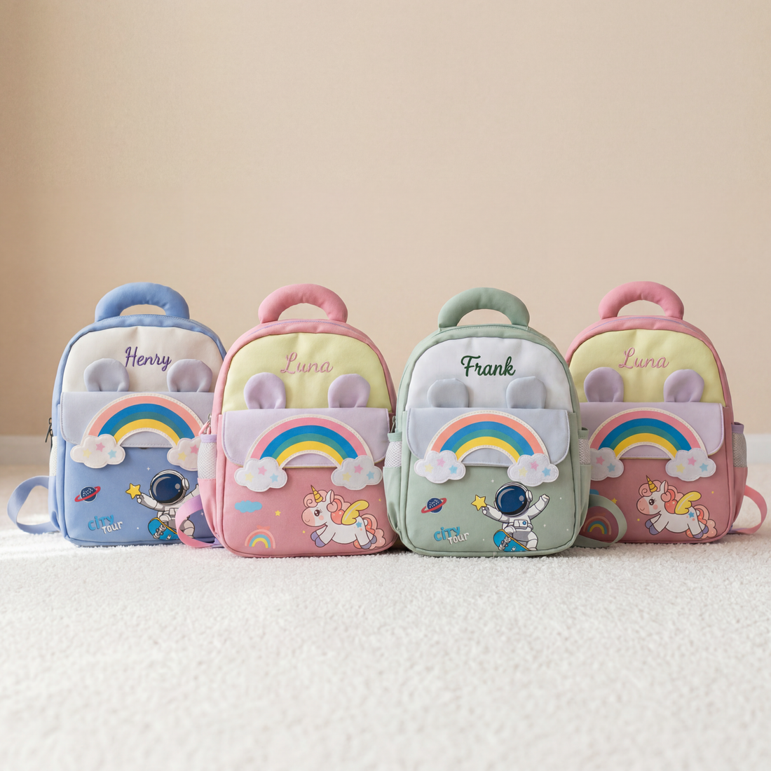 Personalized rainbow kids backpacks with embroidered names, unicorn and astronaut designs